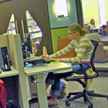 Student using workstation inf the Porter Library